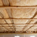 Iinsulation of attic with fiberglass cold barrier and insulation material